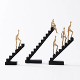 Statue Of Human Figures On Ladder Modern Figure